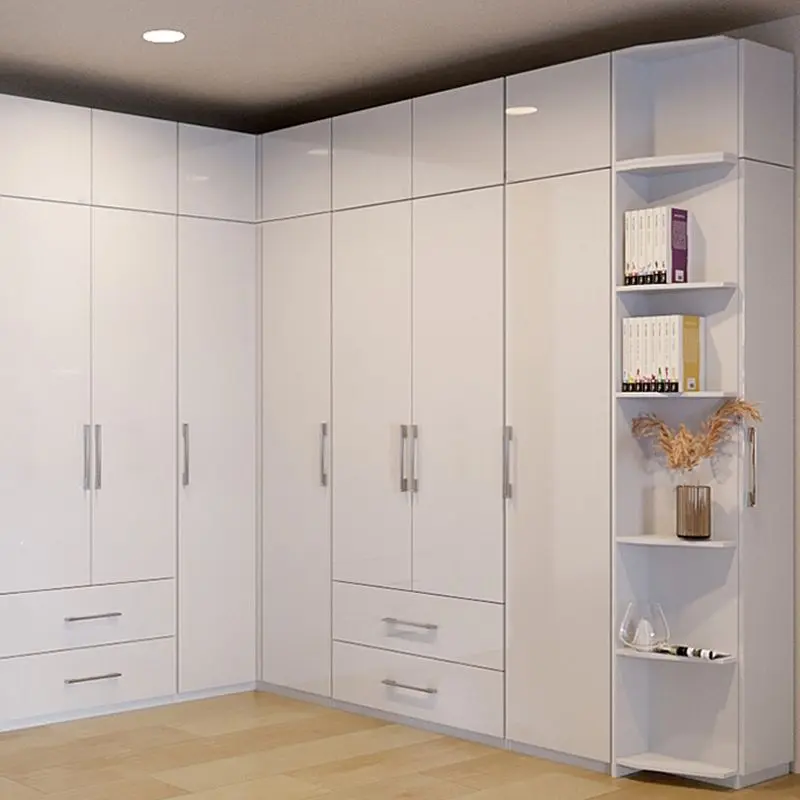 Corner wardrobe set with shelves and upper units in white gloss finish, featuring an open bookcase on the side