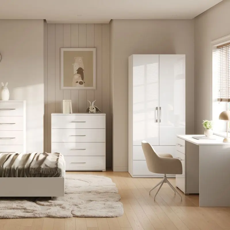 Teen bedroom furniture set in high-gloss white, including a bed, wardrobe, chest of drawers, and desk