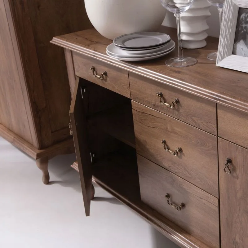 Elegant sideboard made of laminated board in Lefkas oak color with classic Louis-style legs