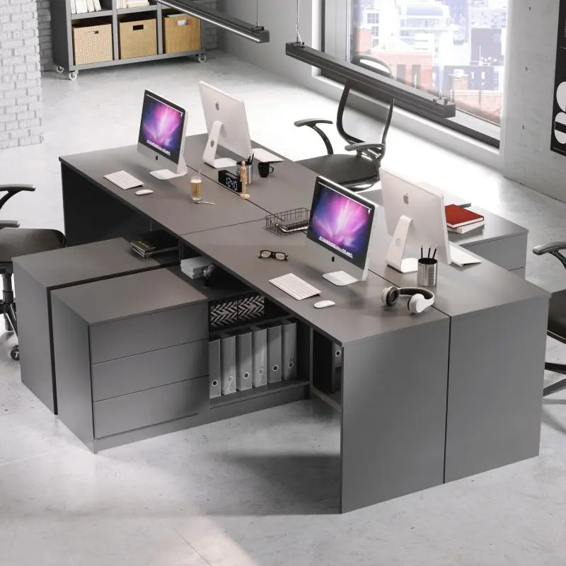 Modular gray corner office desks designed for open space work environments, with integrated storage and space for multiple computer stations