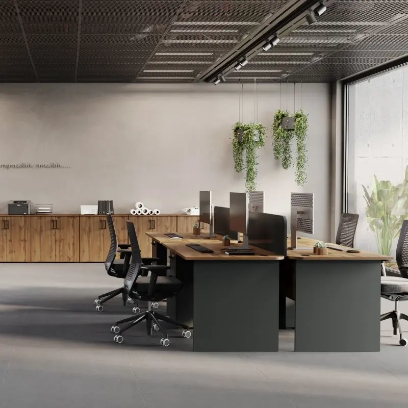 Modern office desks with drawers and low lockable cabinets in oak and grey finish, arranged in a spacious open-plan workspace